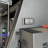 Closed Flip Pro Multi socket installed in a black vehicle canopy power panel