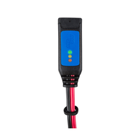 Close-up of a battery indicator module with green, orange and red LED lights