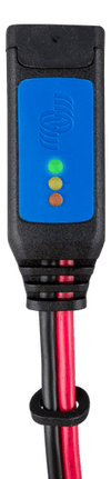 Close-up of a battery indicator module with green, orange and red LED lights