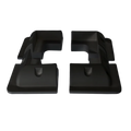 Four black ABS plastic solar panel corner brackets showing aerodynamic profile and internal mounting recesses