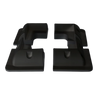 Four black ABS plastic solar panel corner brackets showing aerodynamic profile and internal mounting recesses