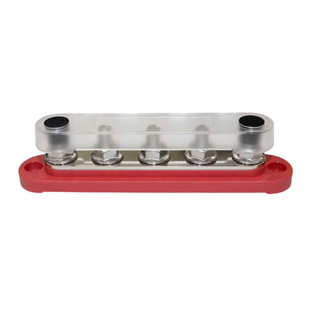 Red busbar with clear polycarbonate cover installed protecting terminals