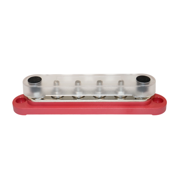 Angled view of red busbar with transparent safety cover installed over studs