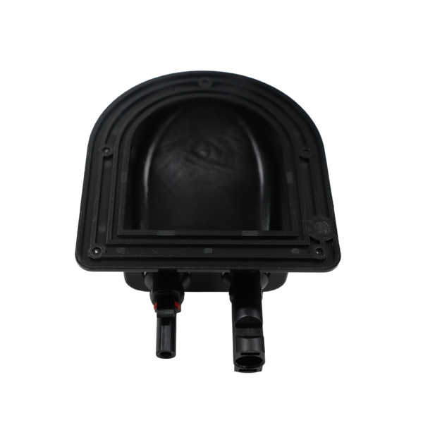 Underside of black plastic housing showing internal cavity and mounting flange
