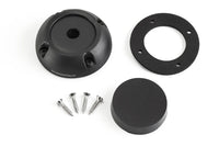 Components of the black cable seal including housing, mounting screws, gasket and rubber bung