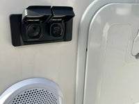 Scanstrut Flip Pro Multi installed on a white caravan exterior wall
