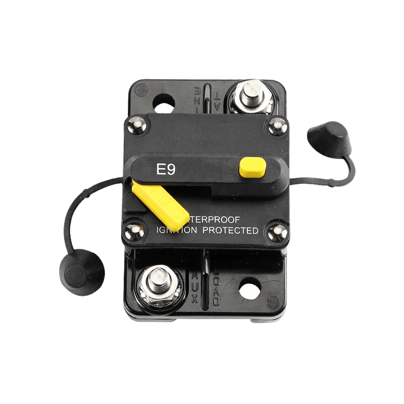Top-down view of circuit breaker with protective caps removed revealing stainless steel studs