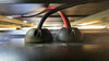 Two black vertical cable seals installed side-by-side routing cables into a flat surface