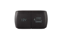 Compact dual power socket unit without bezel showing closed protective lids