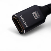 Close-up of female HDMI connector housing labelled 8K UHD