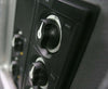 Angled close-up of battery switch mounted on dark control panel showing knob profile