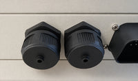 Close-up of black waterproof caps installed on a Wakespeed WS500 regulator housing