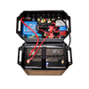 Open battery box lid revealing internal wiring, Victron Orion XS charger and circuit protection