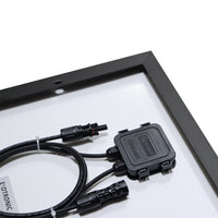Close-up of IP68 rated junction box with MC4 compatible connectors on rear of panel