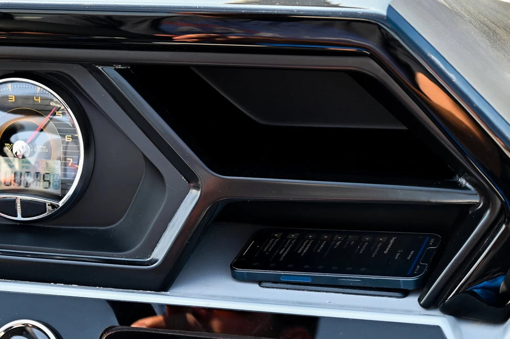 Smartphone charging on a wireless pad installed in a marine boat console