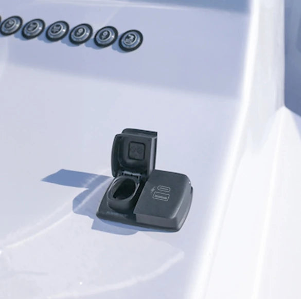 Dual power socket installed on a white marine console with one lid open