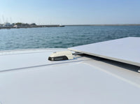 Marine installation of the horizontal cable seal on a boat roof near a flat panel