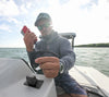 Marine lifestyle view of a phone being charged via the Flip Pro USB socket on a boat console