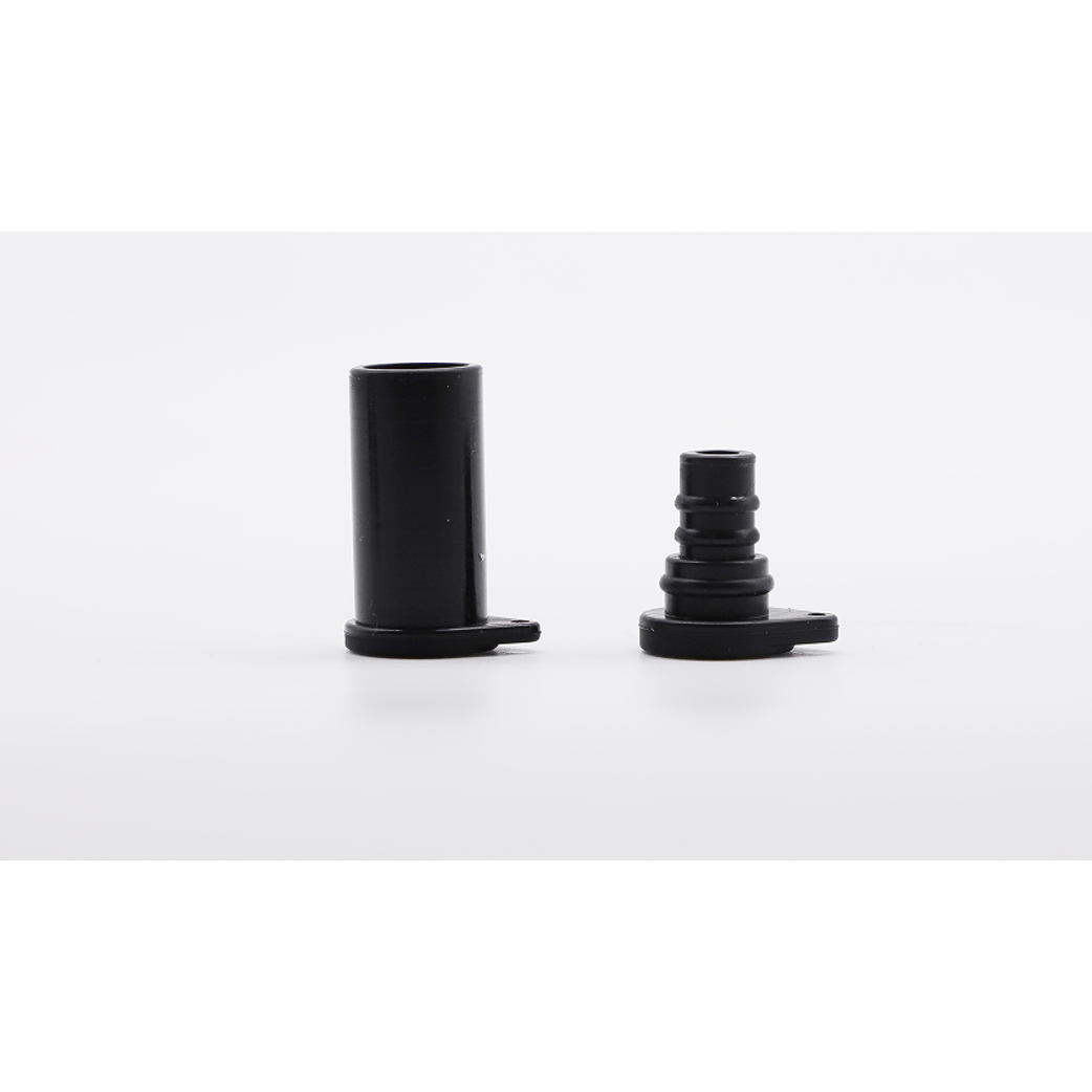 Black male and female solar connector dust caps standing side by side