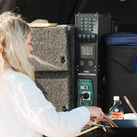 Portable power system being used to run an electric cooktop in a 4WD canopy setup