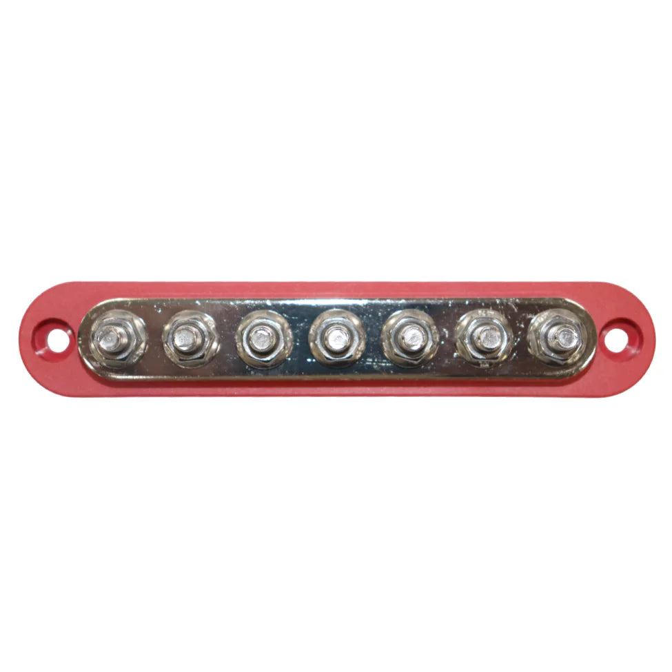 Overhead view of red busbar showing seven tin-plated copper studs and mounting holes