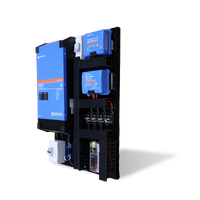 Side angled view of pre-wired Victron power board with inverter and chargers on a black background