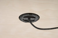 Underside of recessed wireless charger showing mounting through timber panel