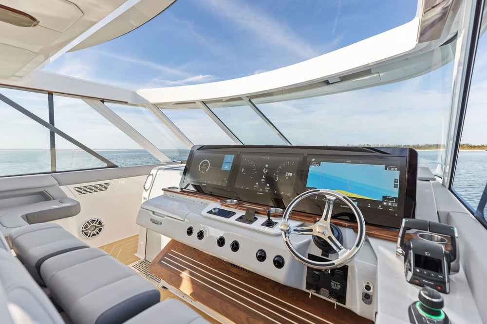 Wide view of a luxury boat cockpit with integrated wireless phone charging