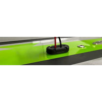 Cable seal installed on a glossy surface with black and red wiring