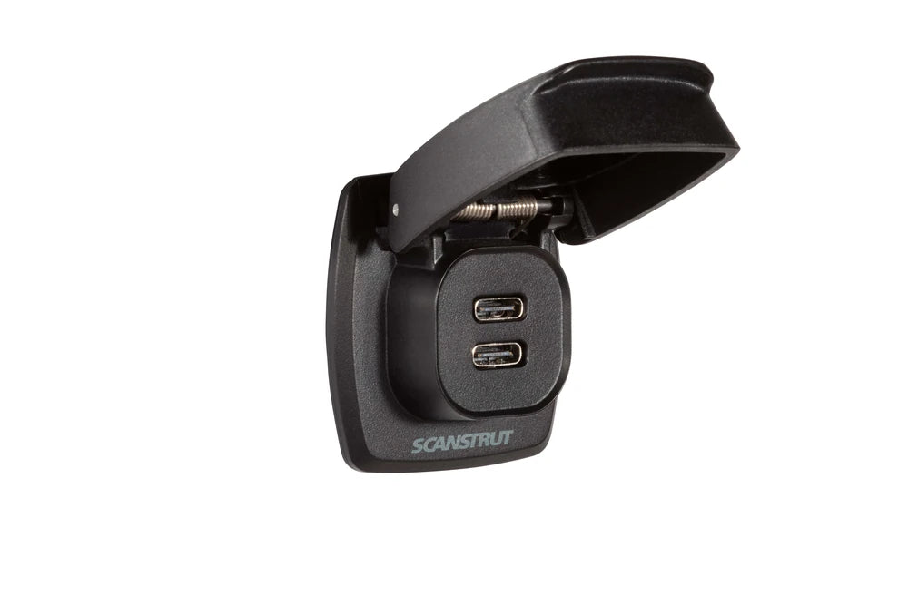 Dual USB-C charge socket with spring-loaded flip lid open to reveal charging ports