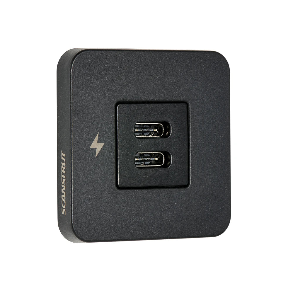 Angle view of black dual USB-C charging socket with square bezel and charging icon