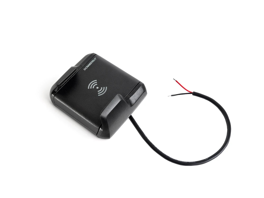 Angled view of Nano wireless charger showing integrated 12/24V power cable