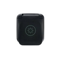 Closed SAE solar input socket with sun icon on the textured black lid