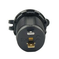 Rear view of 12V socket showing threaded housing and copper spade terminals