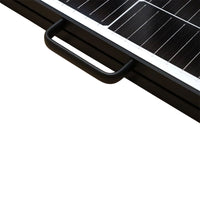 Close-up of black carry handle and frame profile on the solar panel