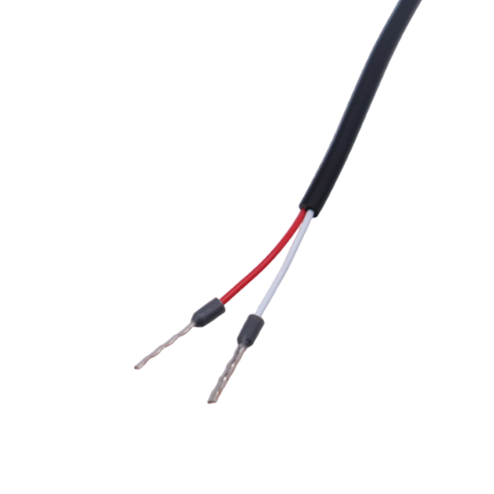 Close-up of red and white wire leads with stripped ends for connection