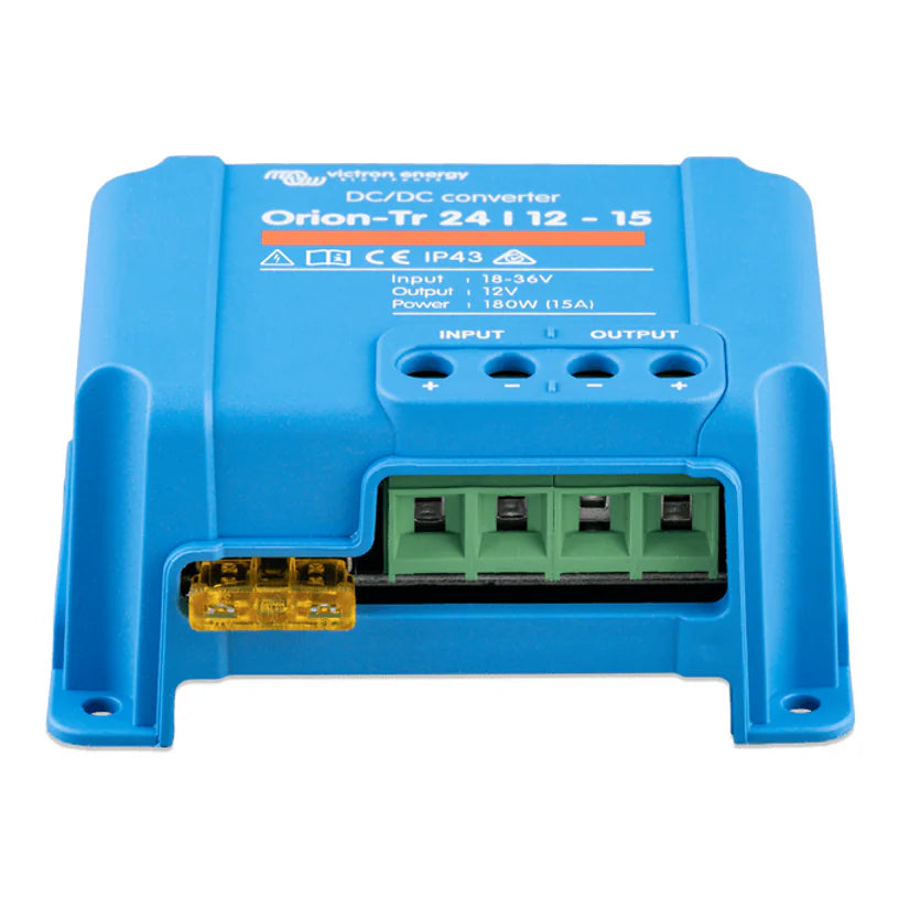 Detail view of the green terminal block and yellow blade fuse for circuit protection