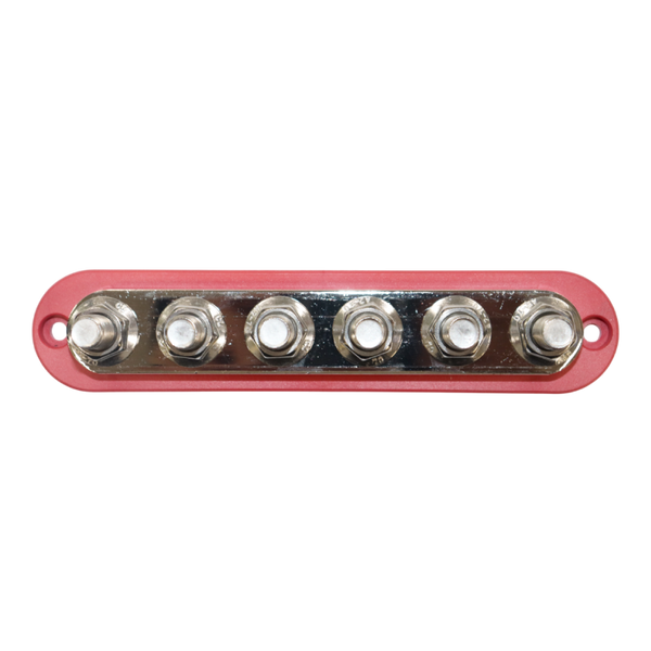 Top-down view of red busbar featuring six stainless steel studs on a nickel-plated plate