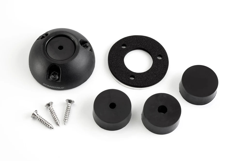 Unassembled components of a black cable seal including shell, gasket, screws and rubber bungs
