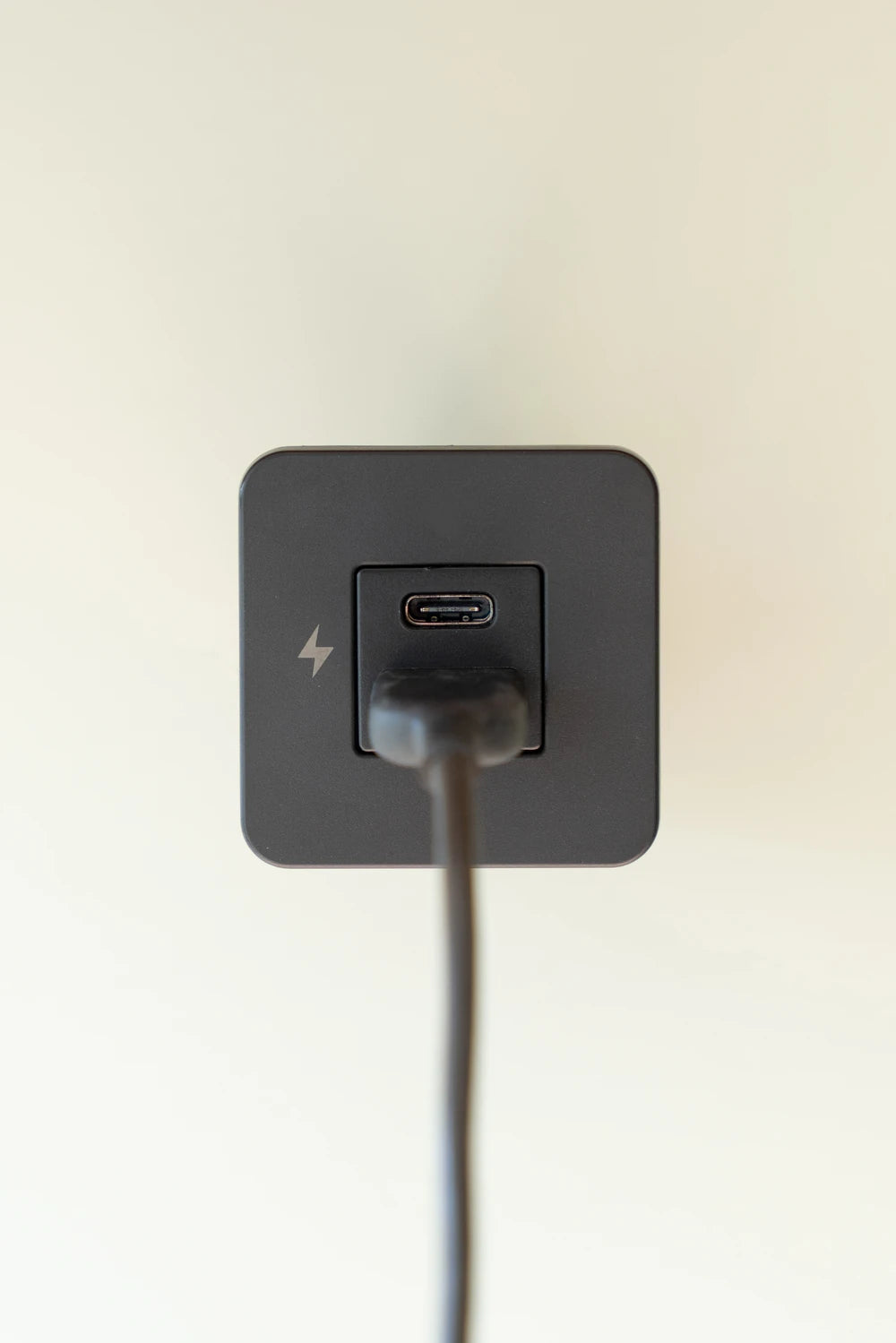 Black USB-A cable plugged into the bottom port of a Scanstrut TILE socket