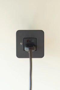 Black USB-A cable plugged into the bottom port of a Scanstrut TILE socket