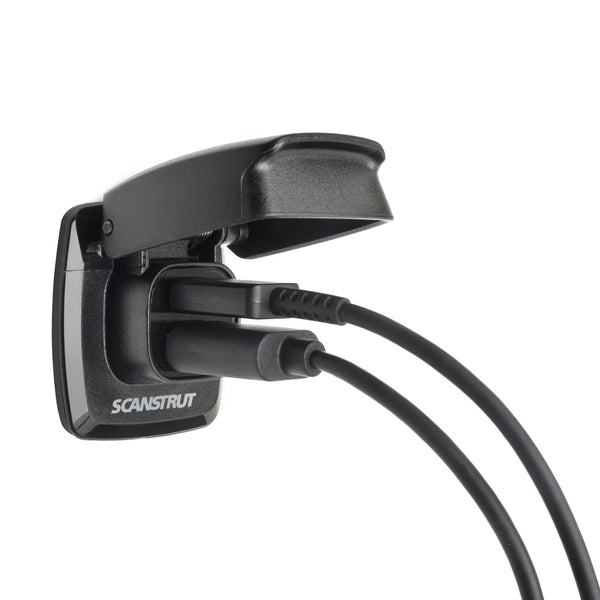 Dual USB socket with two cables plugged in under the protective flip lid