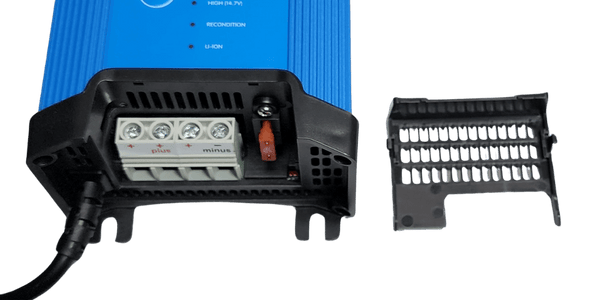 Internal view of battery charger terminals with cover removed showing three outputs