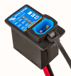Close-up of battery indicator panel face and open charger connection socket