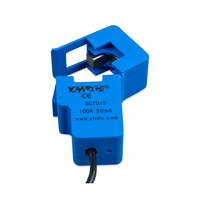 Close-up of blue current transformer with 100A to 50mA rating and SCT013 model markings