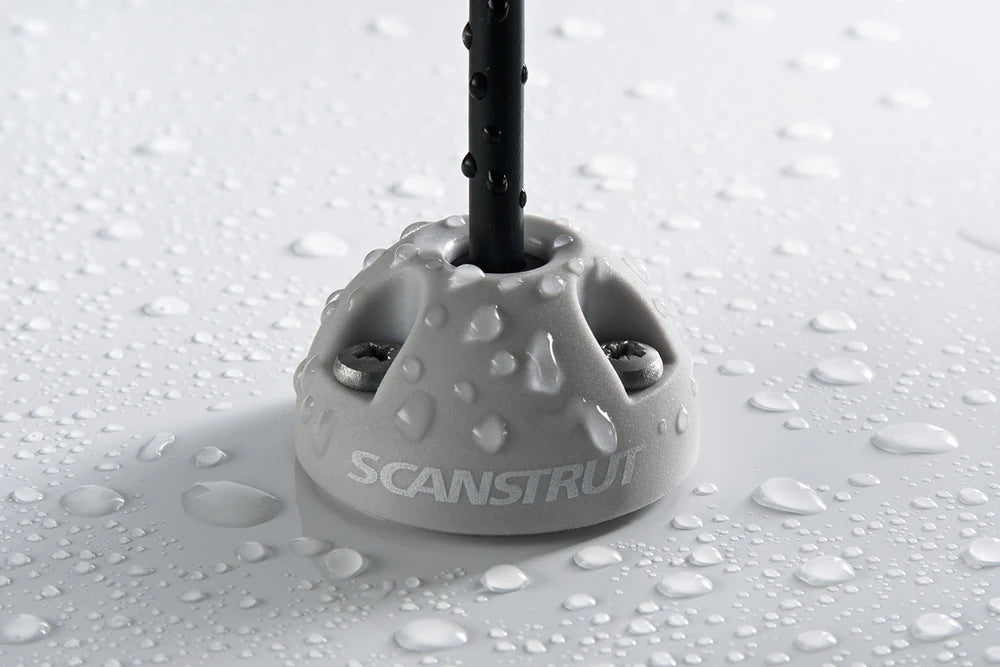 Close-up of light grey Scanstrut cable seal with water droplets demonstrating IP rating