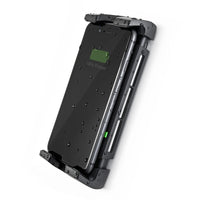 Smartphone charging in waterproof cradle with water droplets on screen