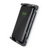 Smartphone charging in waterproof cradle with water droplets on screen