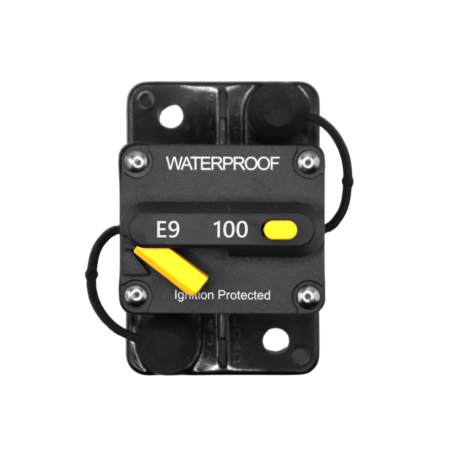 Top-down view of 100A waterproof circuit breaker showing reset lever and trip button