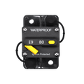 Top-down view of 80A waterproof circuit breaker with yellow reset lever and protective caps